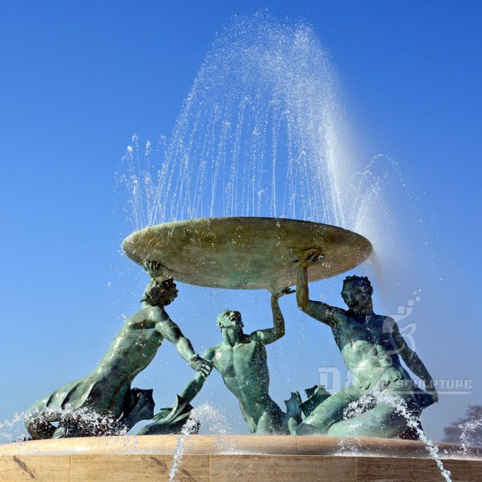 Bronze water fountain with statues