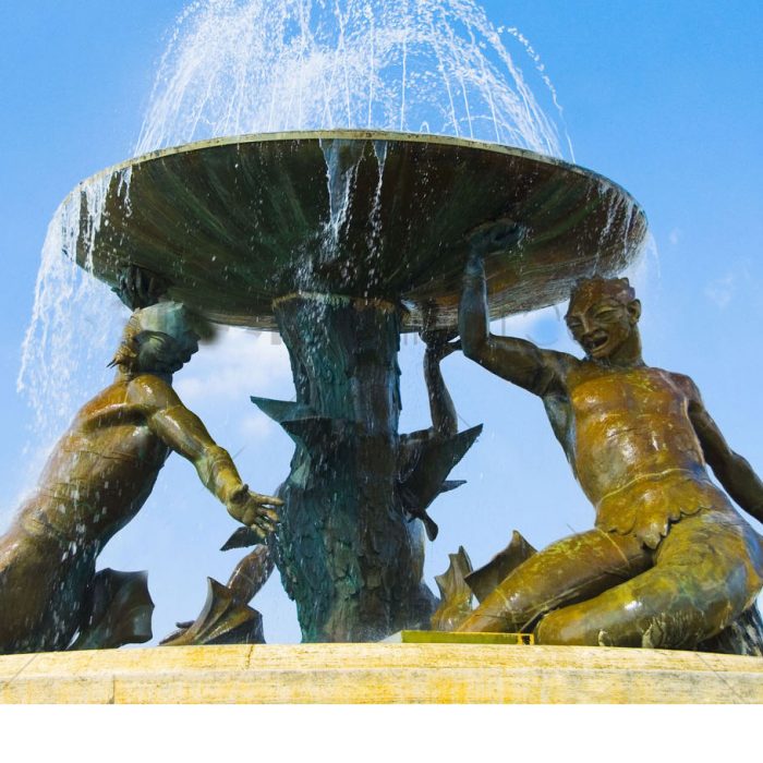 Three bronze Triton statues support a big bowl water fountain for sale