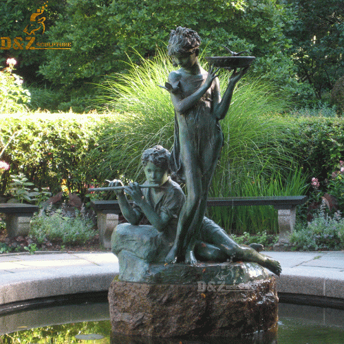 bronze sculpture of a boy playing the flute and a young girl holding a bowl that functions as a birdbath，it depicts Mary and Dickon from The Secret Garden