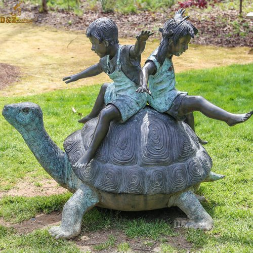 Two children riding balancing on huge turtle bronze statue DZB-77