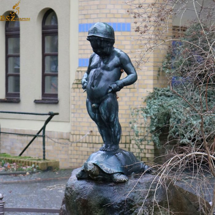 A baby boy standing on the tortoise and have a pee bronze statue fountain DZB-204