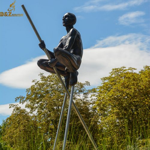 Life size casting bronze nude man perched on tripod satute by artist Nicolas Lavarenne DZB-238