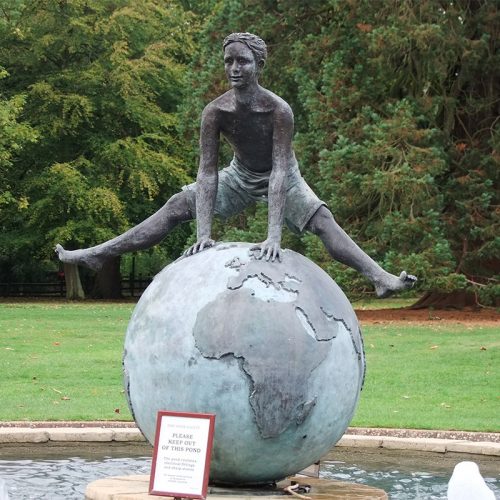 The boy jumping from the globe statue public art decoration DZB-278