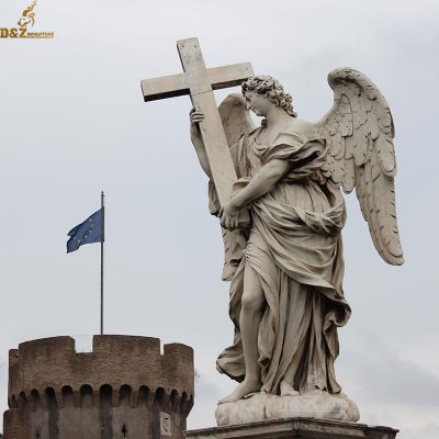 angel holding cross statue